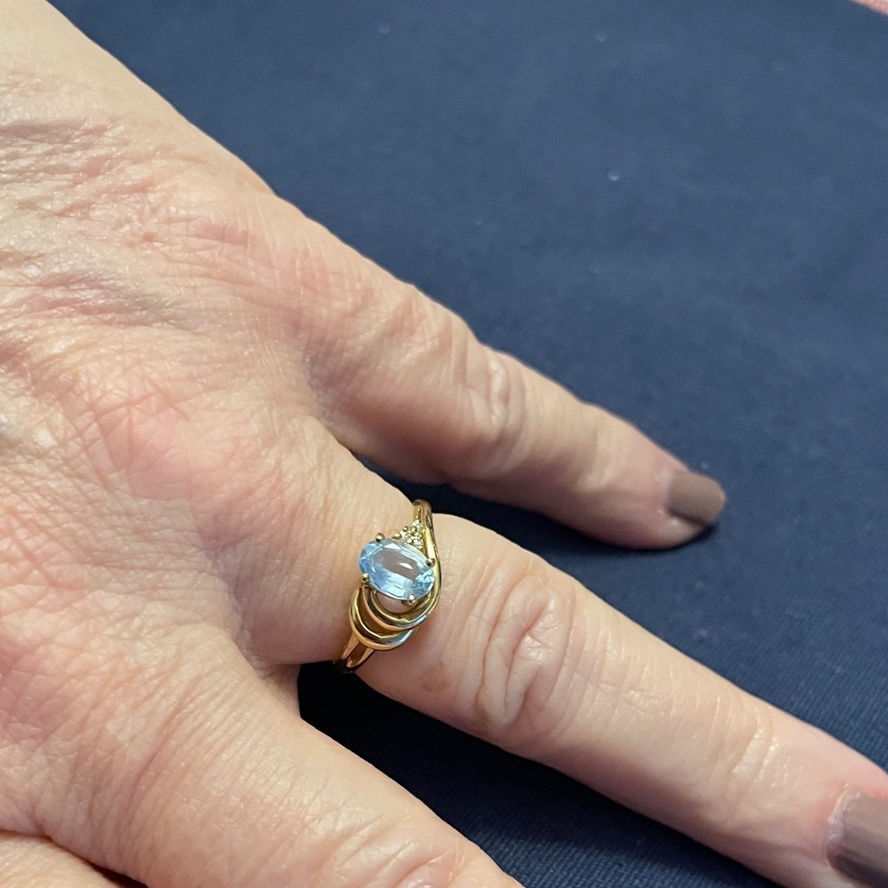 Elegant 14K Gold and Blue Topaz Ring with 3 Diamond Chips